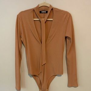 Ribbed bodysuit, necktie allows for multiple styling options. Very lightly worn